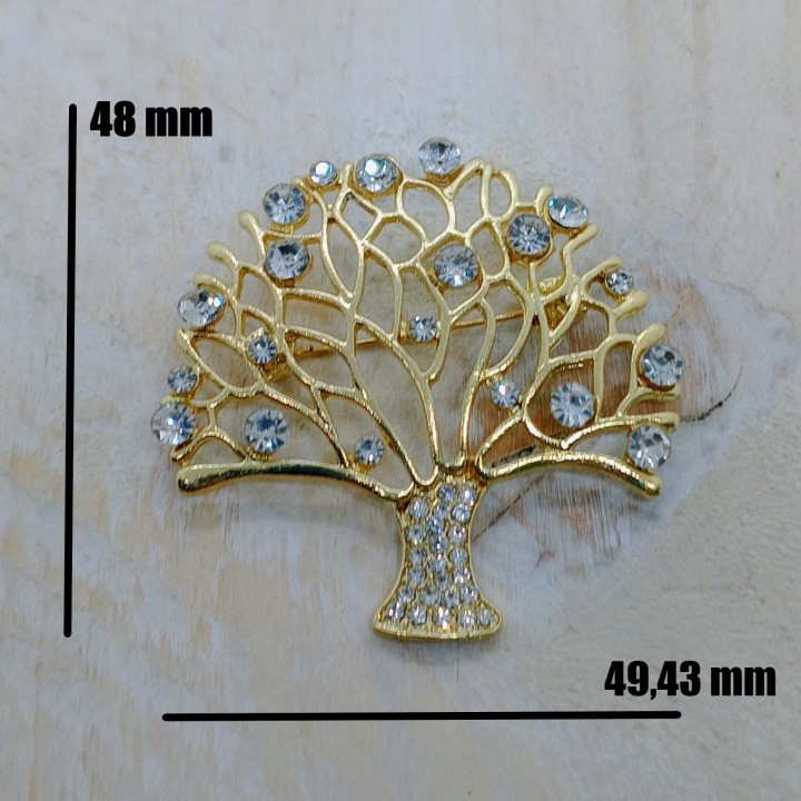 Mise en valeur des dimensions 48 x 49,43 mm pour un accessoire de mode.